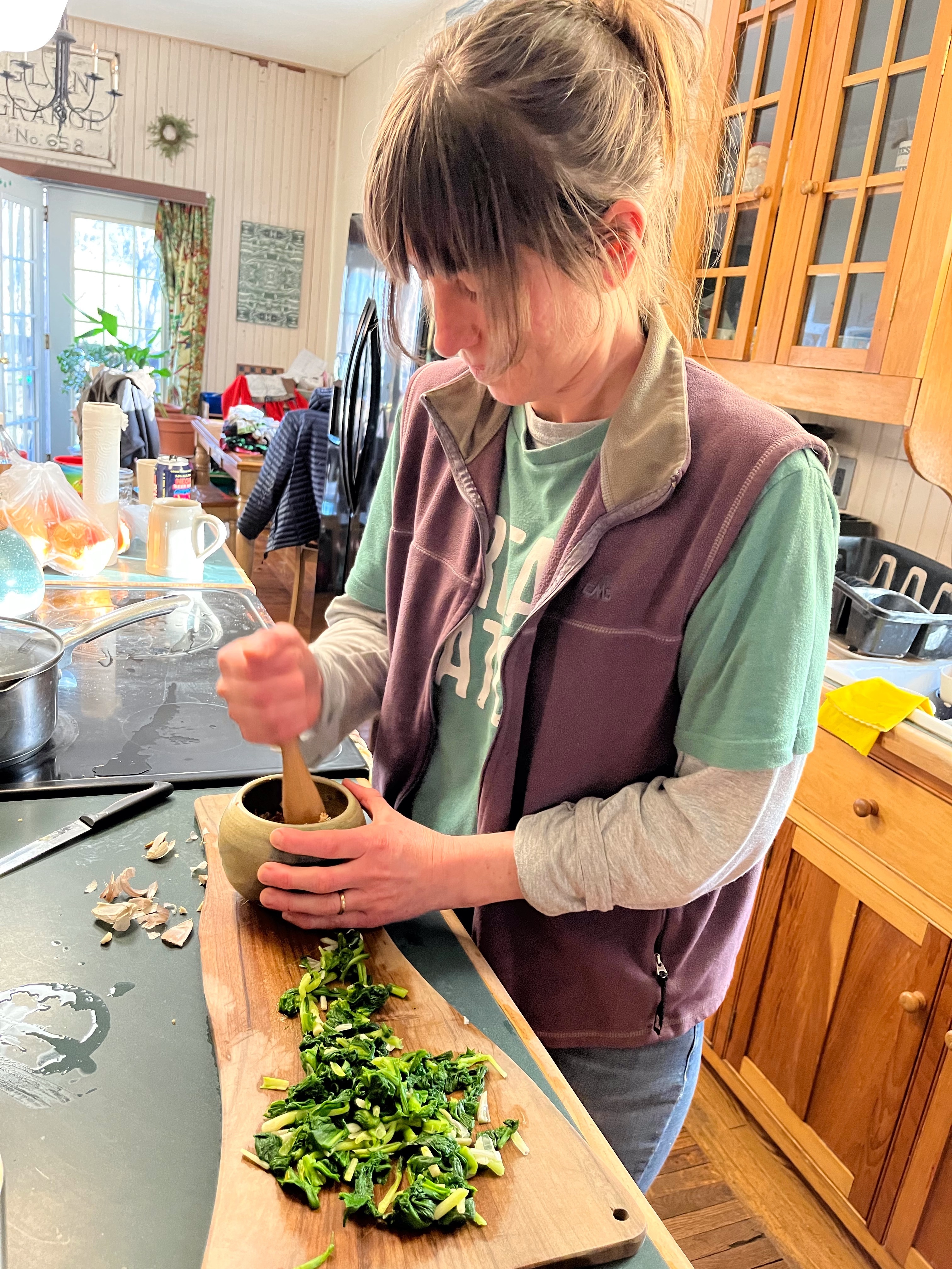 Erin making pesto